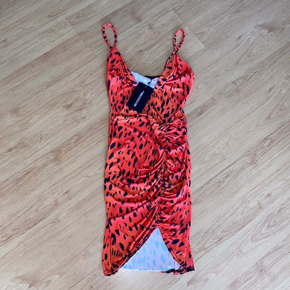 Bodycon dress with ruched bottom.